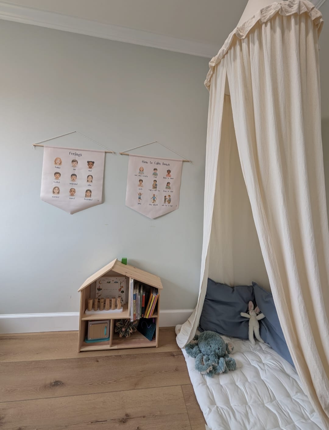 Calm down corner with feelings poster and cozy cushion